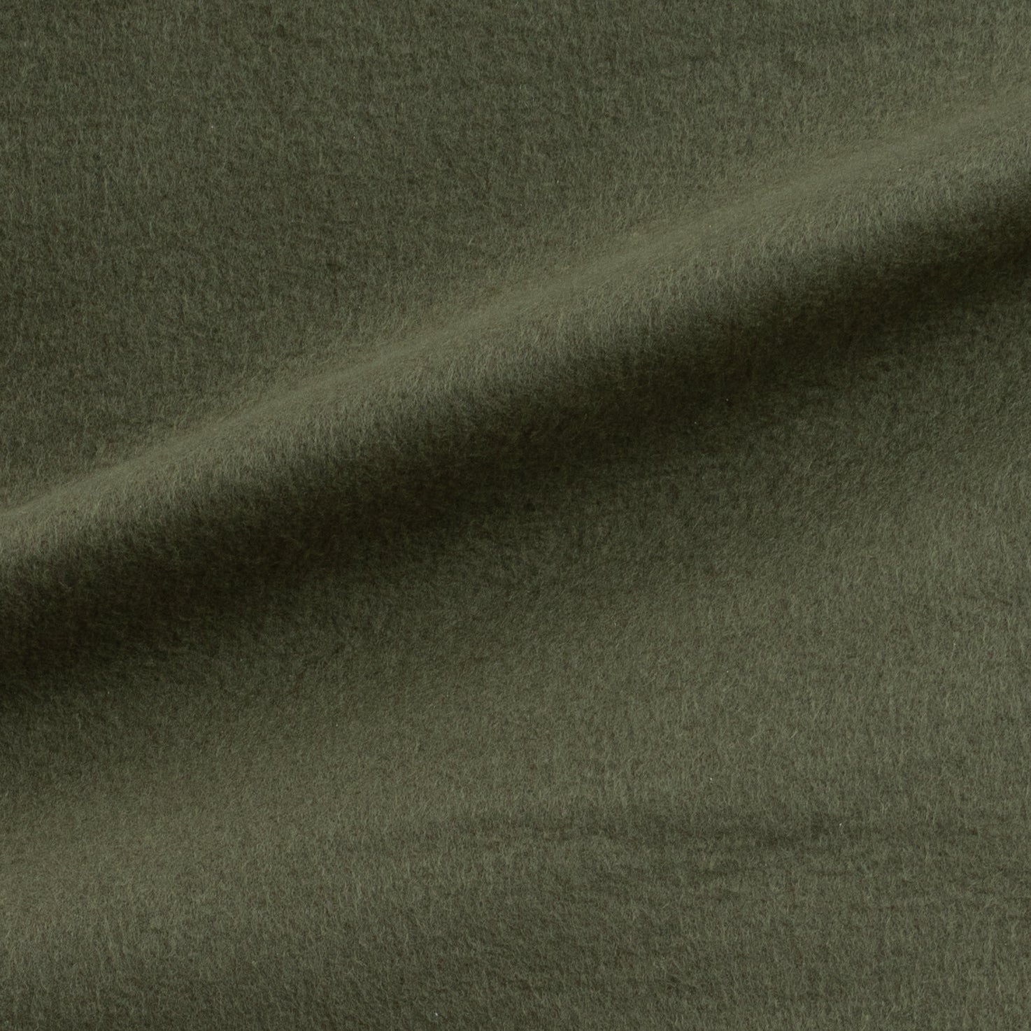 Close-up of dark green fabric with a subtle texture